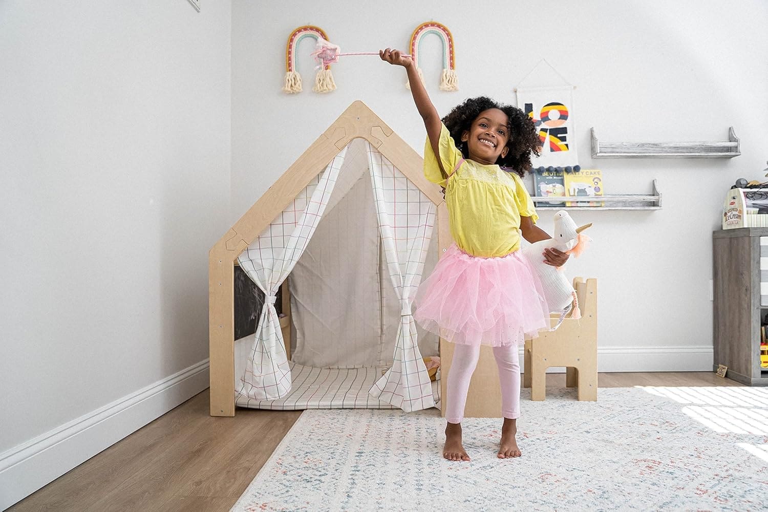 Montessori wooden playhouse with curtains and windows