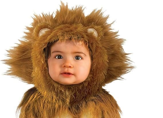 Baby smiling in Rubie’s lion cub baby Halloween costume