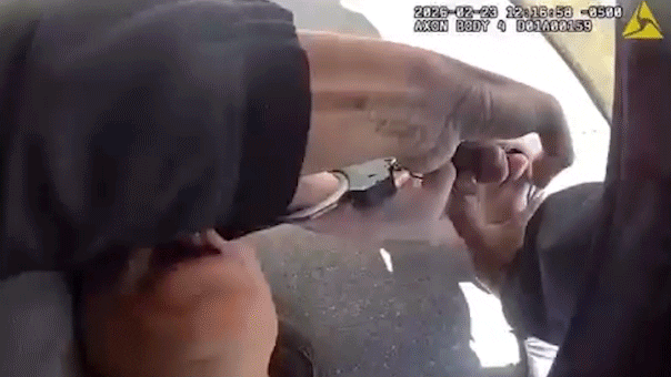 woman attempts to bite an officer